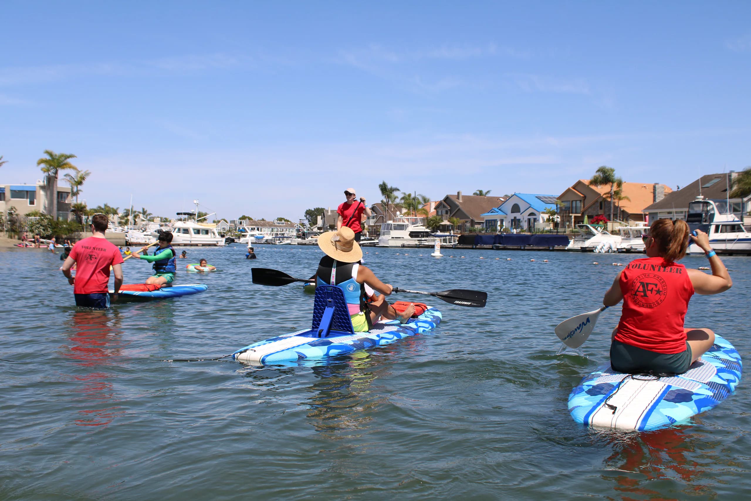 AFF participants and volunteers paddling together on calm water