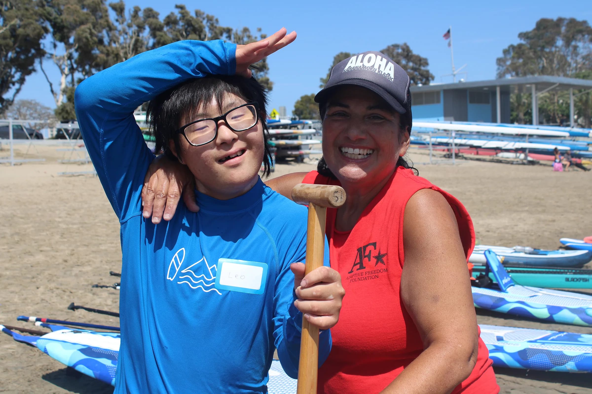 A participant and AFF volunteer smiling together after paddling